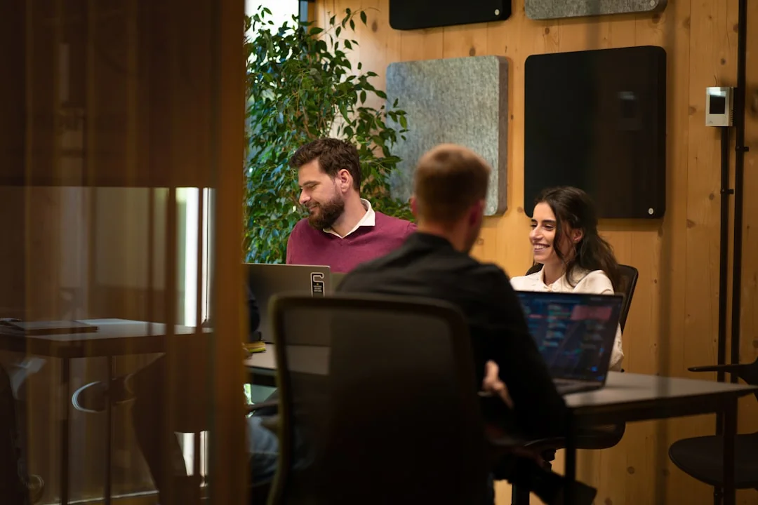 Team discussing marketing strategies in a modern office setting with charts and documents.
